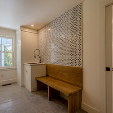foyer of extensive renovation transformed an existing c. 1840 Weston home into a warm, refined Vermont retreat