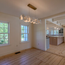 dining room of an extensive renovation transformed an existing c. 1840 Weston home into a warm, refined Vermont retreat