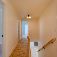 hallway of an extensive renovation transformed an existing c. 1840 Weston home into a warm, refined Vermont retreat