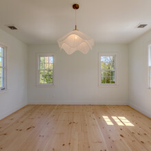 room of an extensive renovation transformed an existing c. 1840 Weston home into a warm, refined Vermont retreat