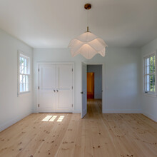 room of an extensive renovation transformed an existing c. 1840 Weston home into a warm, refined Vermont retreat